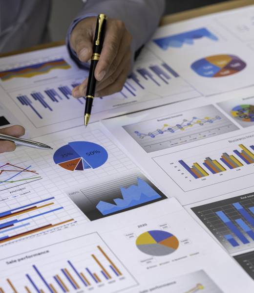 Analyzing results, business people are meeting to analyze data for the marketing plan. Concept of finance economy, banking business, and stock market research.