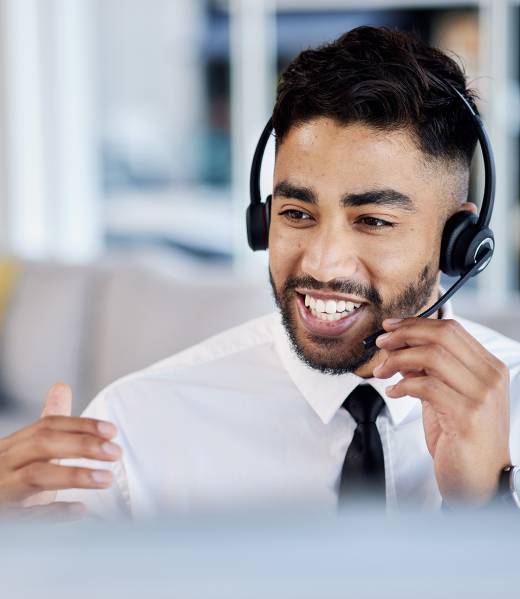 Call center, telemarketing and man with customer service, communication and crm with headphones. Ma.